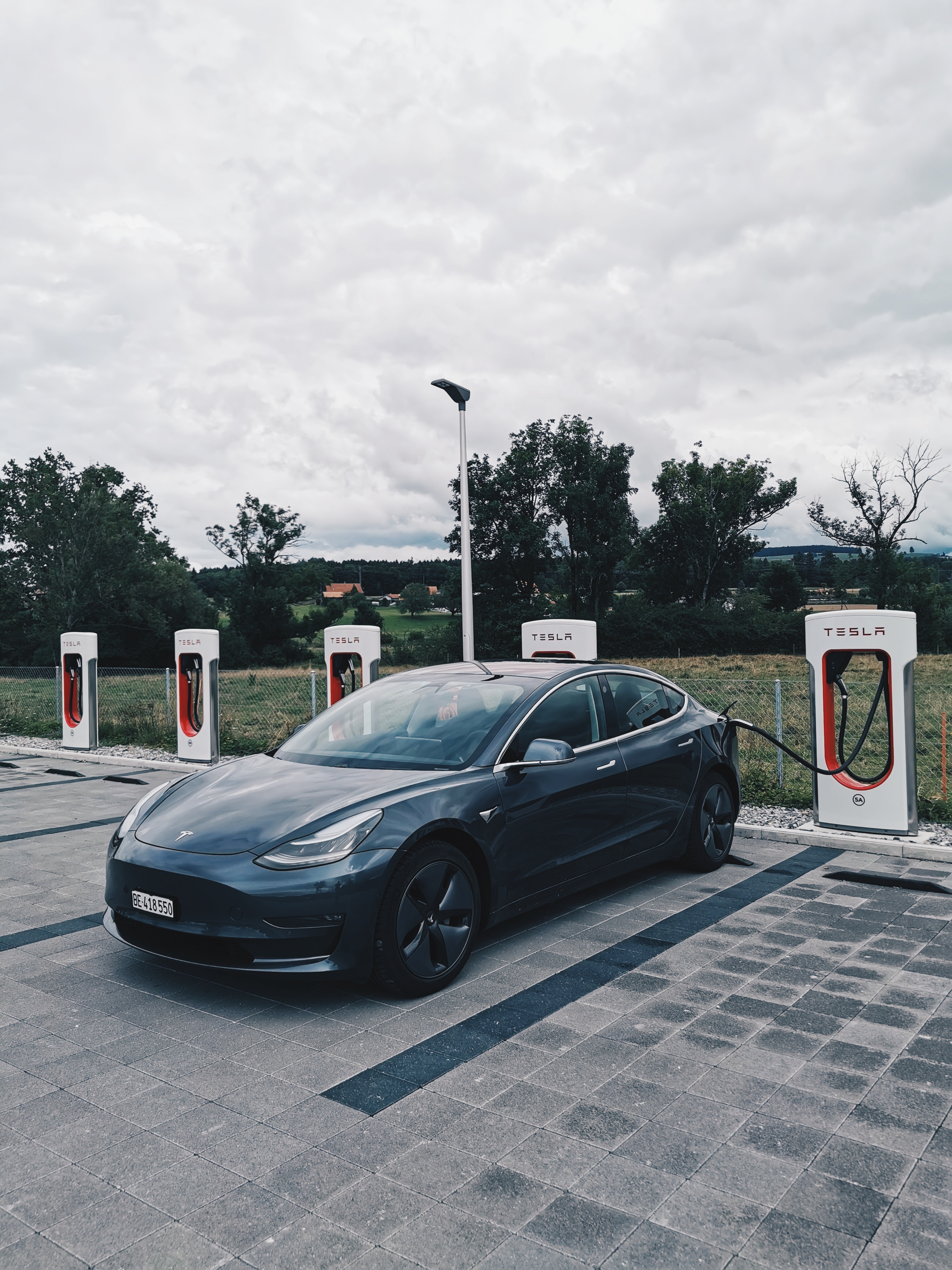A Model 3 charging at a Tesla Supercharger.